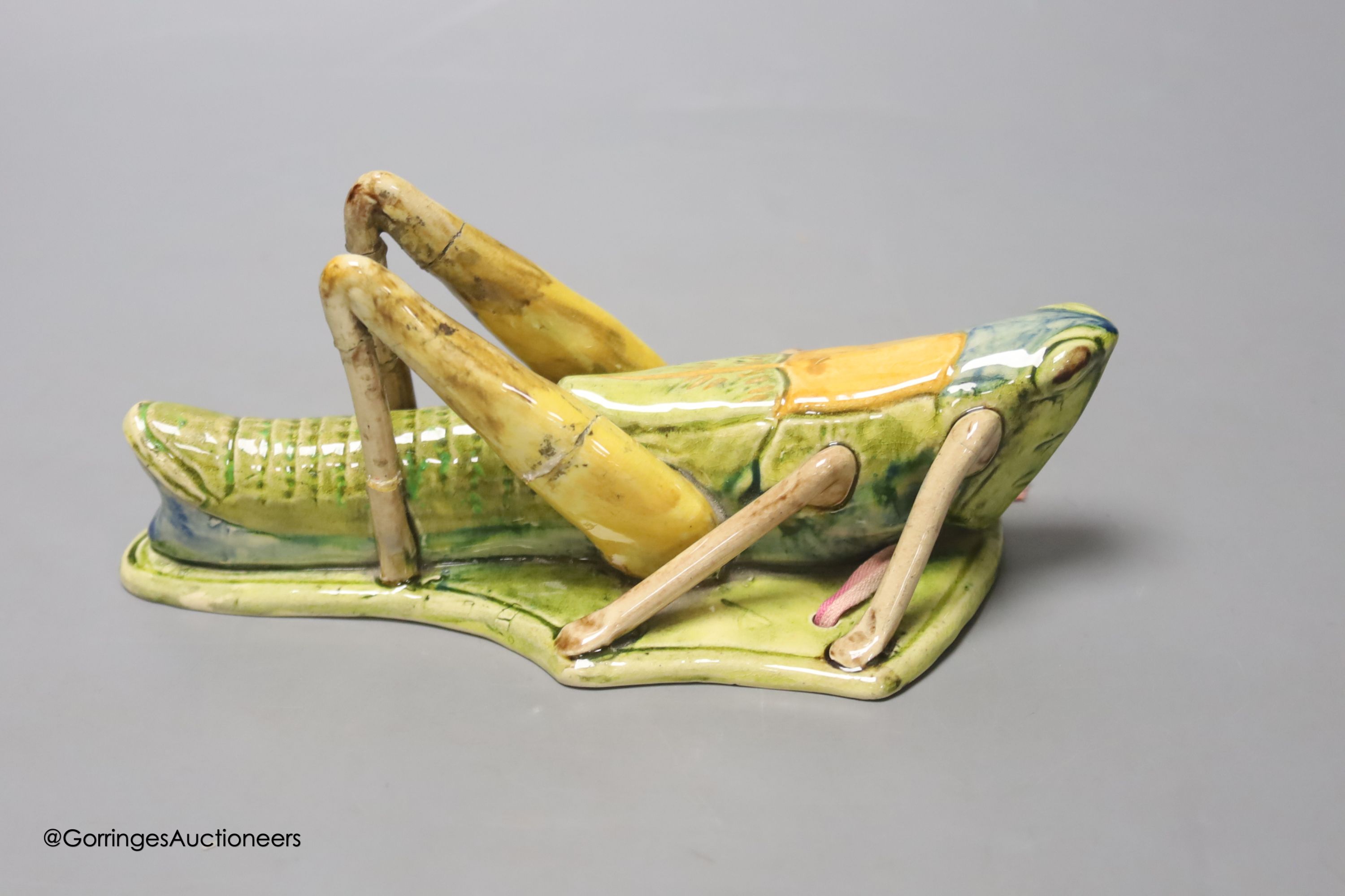 A Continental pottery 'grasshopper' wall pocket, early 20th century, possibly Caldas da Rainha, length 19cm